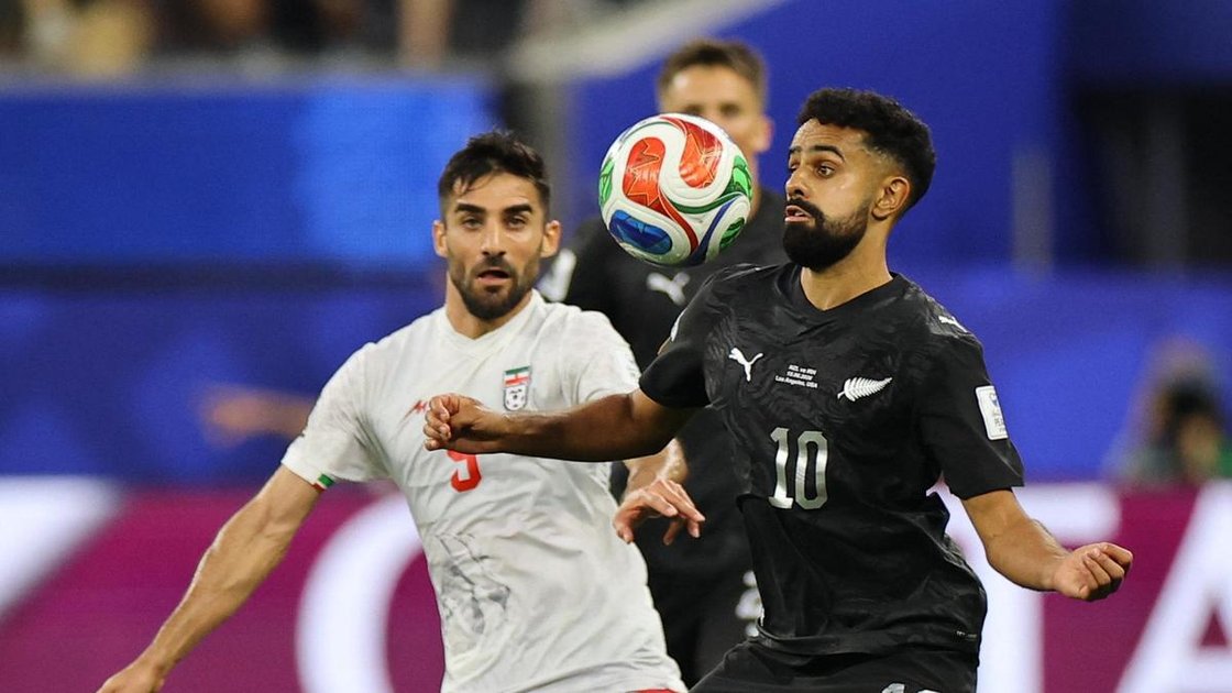 Sarpreet Singh in action against Iran's Milad Mohammadi during FIFA World Cup 2026 Group G match