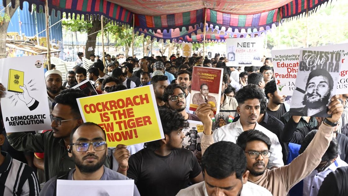 Protesters holding placards against NEET paper leak in Hyderabad