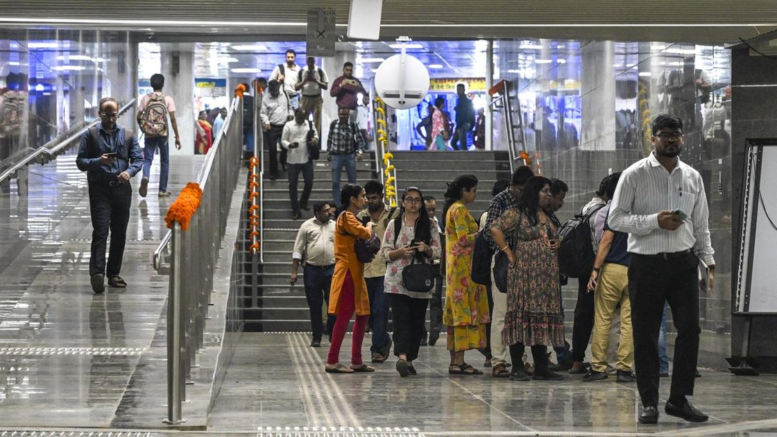 Commuters inside Mumbai Metro Line 3 (Aqualine) with mobile phones, now receiving network coverage