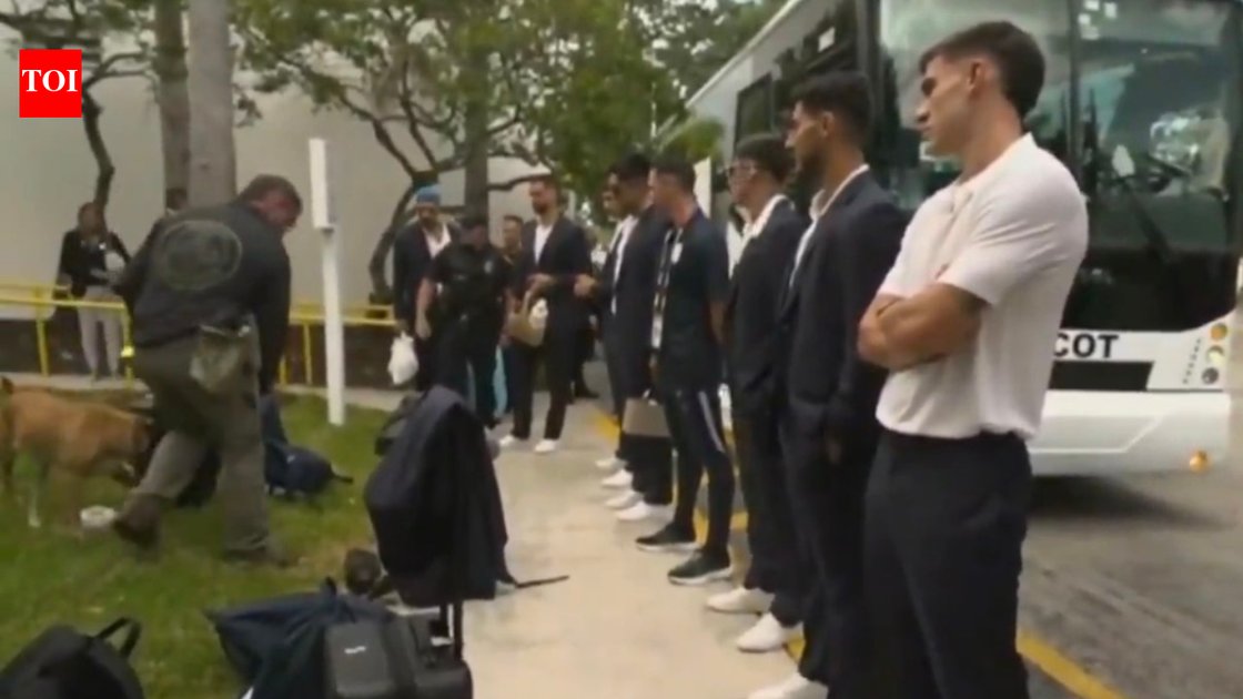 Uruguay football team with a sniffer dog on the field